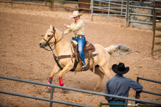 istock Young cowgirl barrel racing rodeo 1162081459