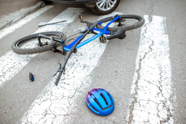 istock Road accident with car and broken bicycle 1162083748