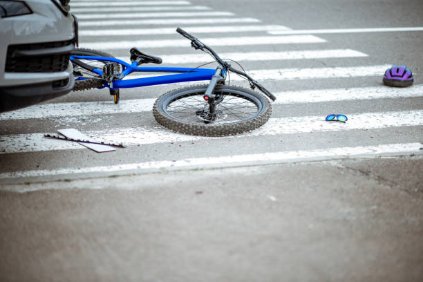 istock Road accident with car and broken bicycle 1162083773