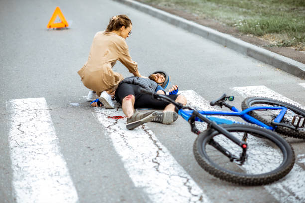 istock Road accident with injured cyclist and car driver 1162083787