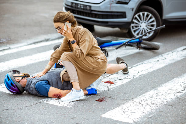 Road accident with injured cyclist and car driver