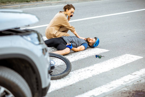 istock Road accident with injured cyclist and car driver 1162083799