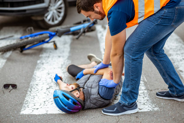 istock Road accident with injured cyclist and car driver 1162083879