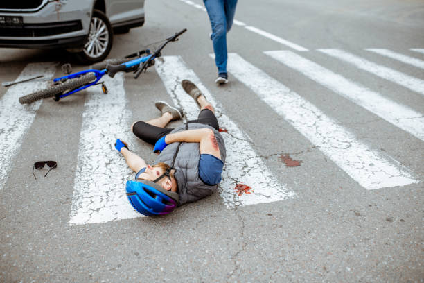istock Road accident with injured cyclist and car driver 1162083896