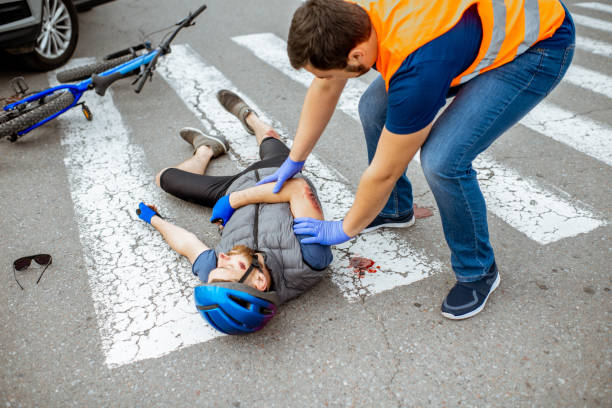 istock Road accident with injured cyclist and car driver 1162083901