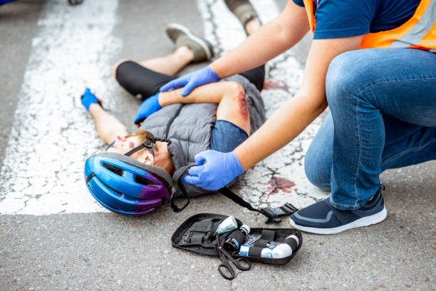 istock Road accident with injured cyclist and car driver 1162083967