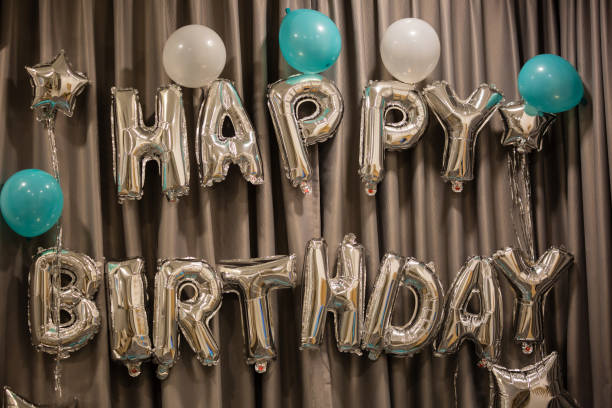 istock Upper case letters HAPPY BIRTHDAY from silver balloons view 1162084878