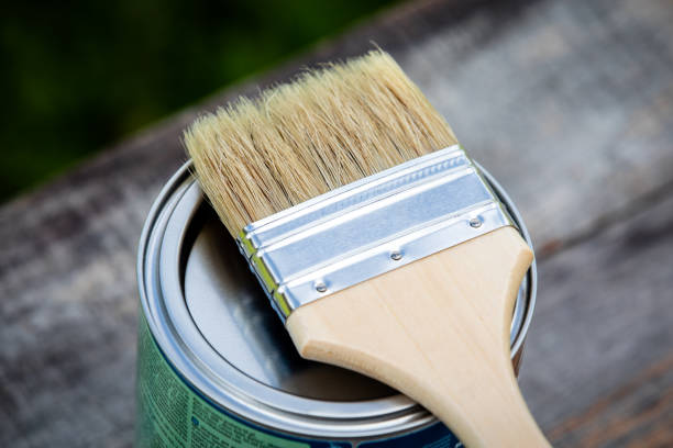 istock Paint brush placed on top of a can 1162084917