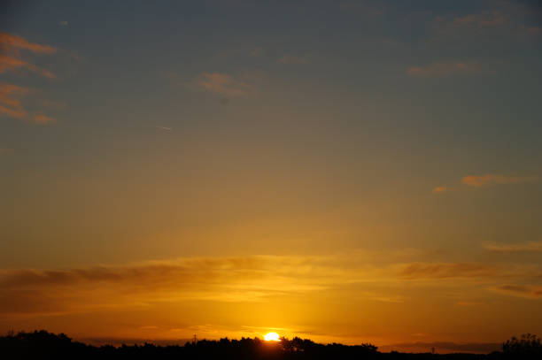 Golden sunrise in the country at the beginning of a warm late summer day