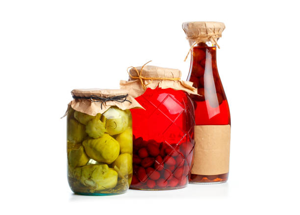 istock glass bottle with preserved food on black background - Image 1162089561