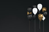 Balloons on black background, black friday concept