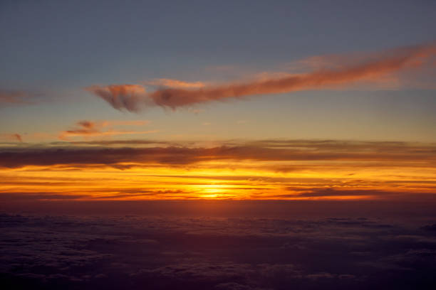 istock orange sky from and airplane window 1162090760