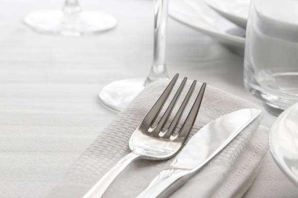 istock Table set with silver cutlery and glassware. Dinning concept background. Close up.Copy space 1162091736