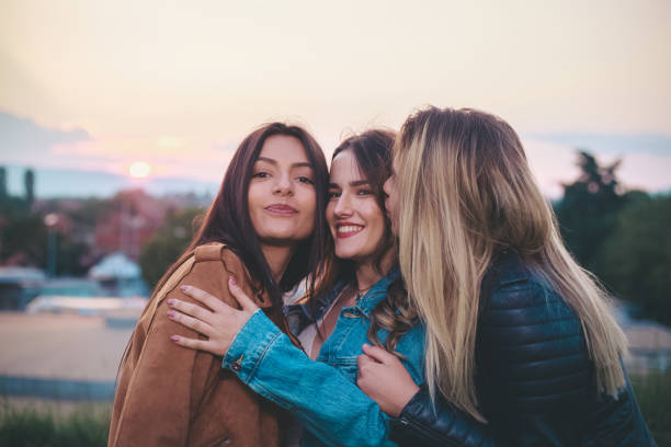 istock Three teenage girls having fun 1162091833