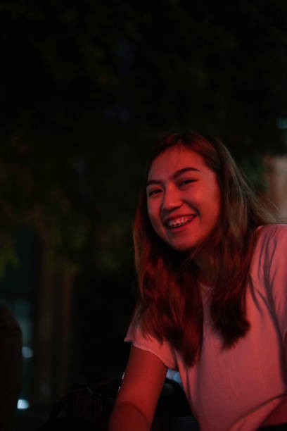 istock Happy Asia Woman Face with Red Neon 1162091868