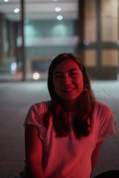 istock Happy Asia Woman Face with Red Neon 1162091870