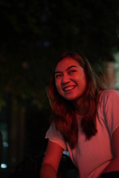istock Happy Asia Woman Face with Red Neon 1162091875
