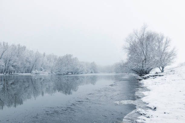 istock Winter lake scene reflecting in the water 1162092882