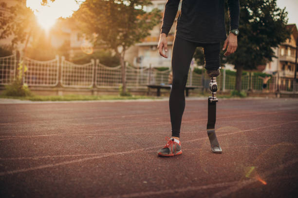 istock Guy with one leg standing on race track 1162094293