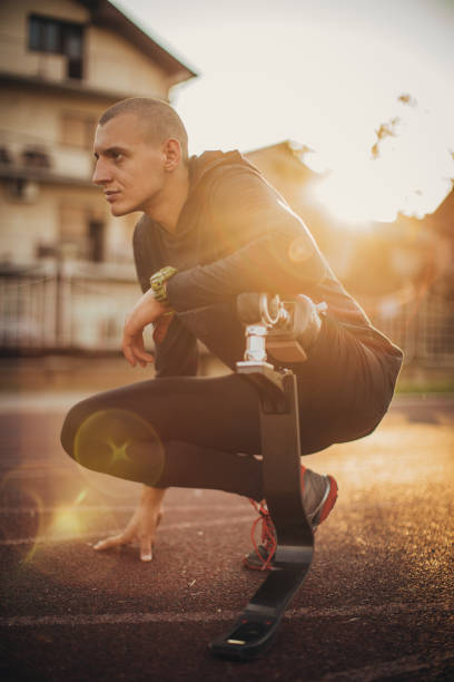 istock Disability man athlete crouching on race track 1162094629