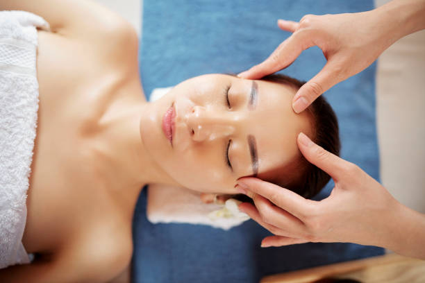 istock Young Asian woman getting face massage 1162095931