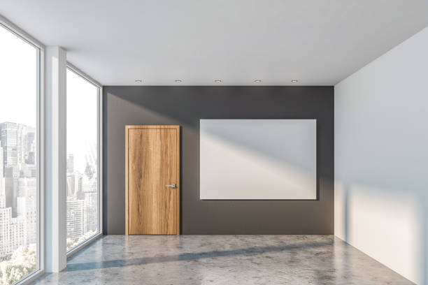 istock Empty white and gray room, door and poster 1162102711