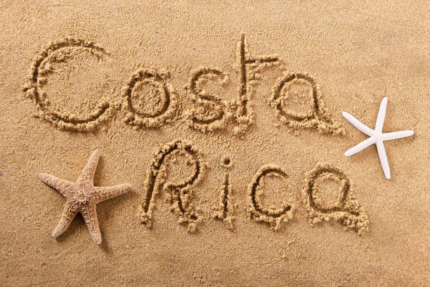 Costa Rica beach sand sign message stock photo