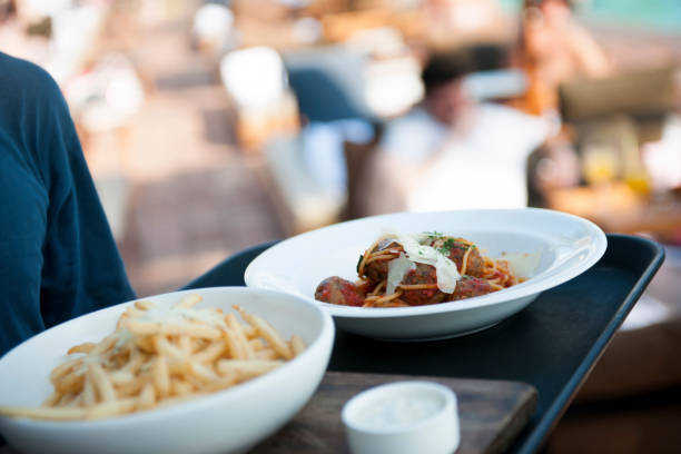 istock Waiter serving food on the tray 1162103482