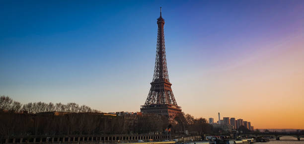 istock Panaramic view of  the Eiffel tower and Seine river in the sunset sky scene. 1162104371