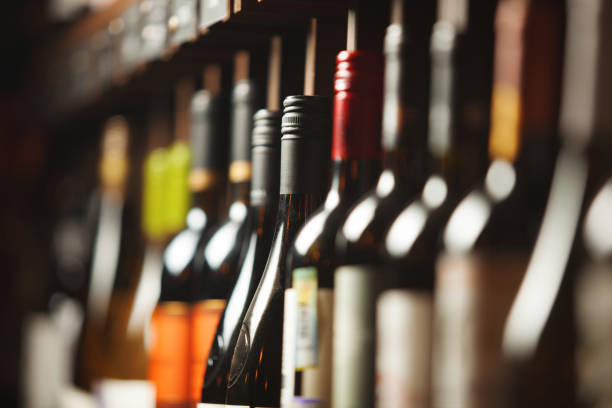 istock Wine cellar with elite drinks on shelves with written names 1162104690