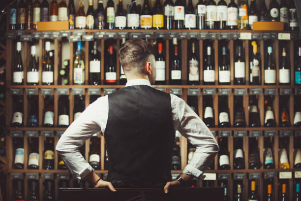 istock Sommelier at wine cellar full of bottles with exquisite drinks 1162105560