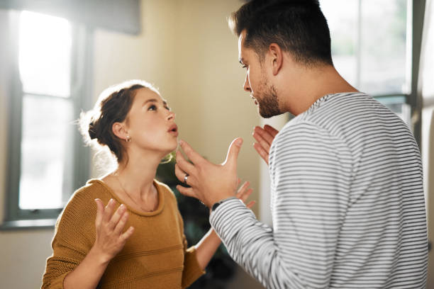 You never listen! Cropped shot of a young couple having an argument at home fighting stock pictures, royalty-free photos & images
