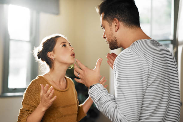 You never listen! Cropped shot of a young couple having an argument at home heterosexual couple stock pictures, royalty-free photos & images