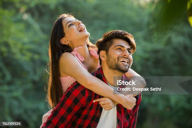 Young Couple In Public Park Stock Photo Stock Photo - Download Image Now - Couple - Relationship, India, Happiness - iStock Young Couple In Public Park Stock Photo Stock Photo - Download Image Now - Couple - Relationship, India, Happiness - iStock