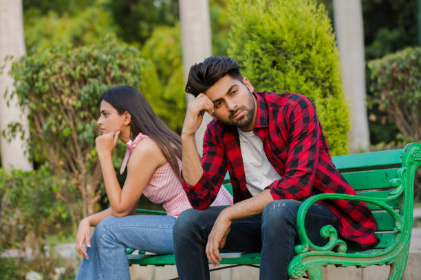 Young couple in public park - stock photo India, 20-29 Years, Adult, Adults Only, Beard separation india stock pictures, royalty-free photos & images