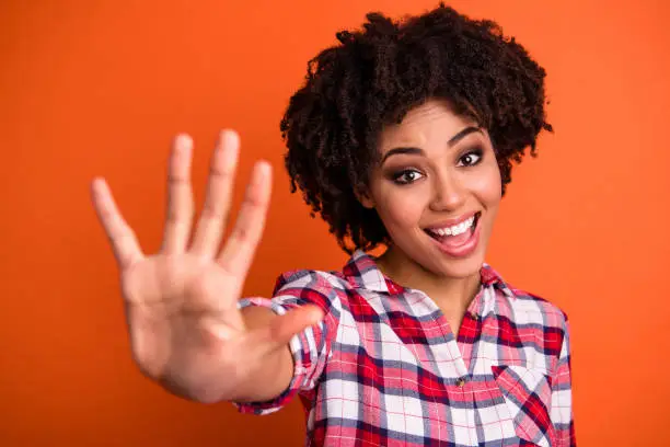 Photo of Close-up portrait of her she nice attractive lovely cute cheerful cheery optimistic wavy-haired lady giving 5 best offer done isolated over bright vivid shine orange background