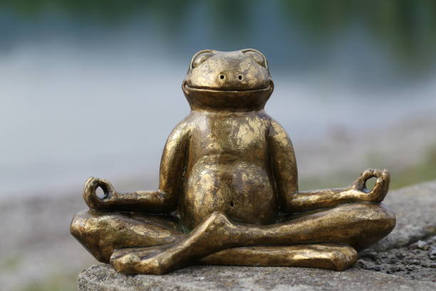 istock Frog sculpture in typical yoga pose 1162111862