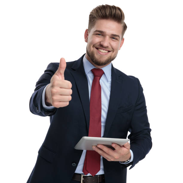 istock Happy businessman holding a tablet and gesturing ok 1162112554