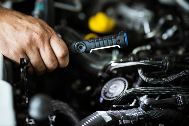 istock Close up of a mechanic working on car engine. 1162113124