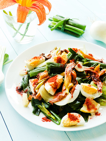 Daylily flowers salad with boiled eggs. Shallow dof.