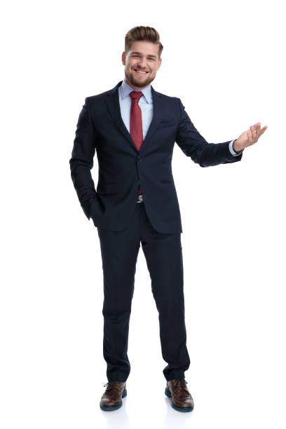 istock Cheerful businessman presenting with his hand in his pocket 1162116085