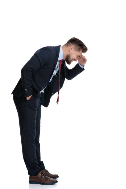 istock Side view of a curious businessman looking down 1162116341