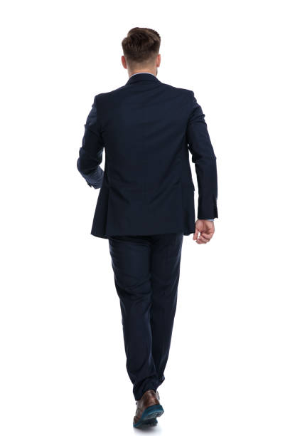 istock Rear view of a walking businessman 1162117088