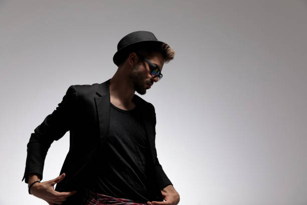 istock Young fashion guy adjusting his jacket 1162117640