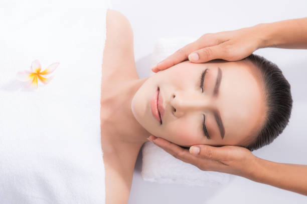 istock Woman enjoying massage in spa salon. 1162119144
