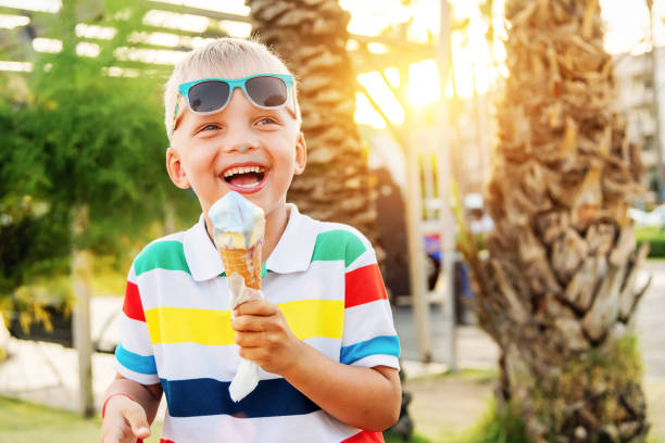 istock Happy little boy. The child eats ice cream on a hot evening. 1162119519