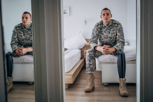 istock Disabled veteran US soldier sitting in bedroom 1162121819