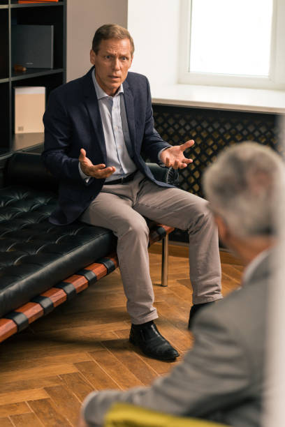 istock Indignant middle-aged Caucasian man sitting on the couch 1162122894