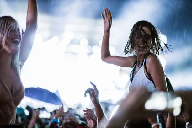 istock Dancing on music festival during rainy night! 1162123334