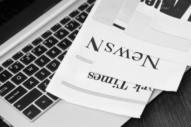 istock Newspapers and Laptop 1162124166